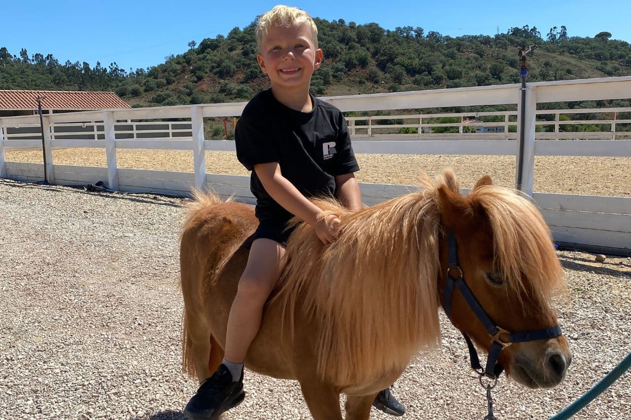 boy riding a pony