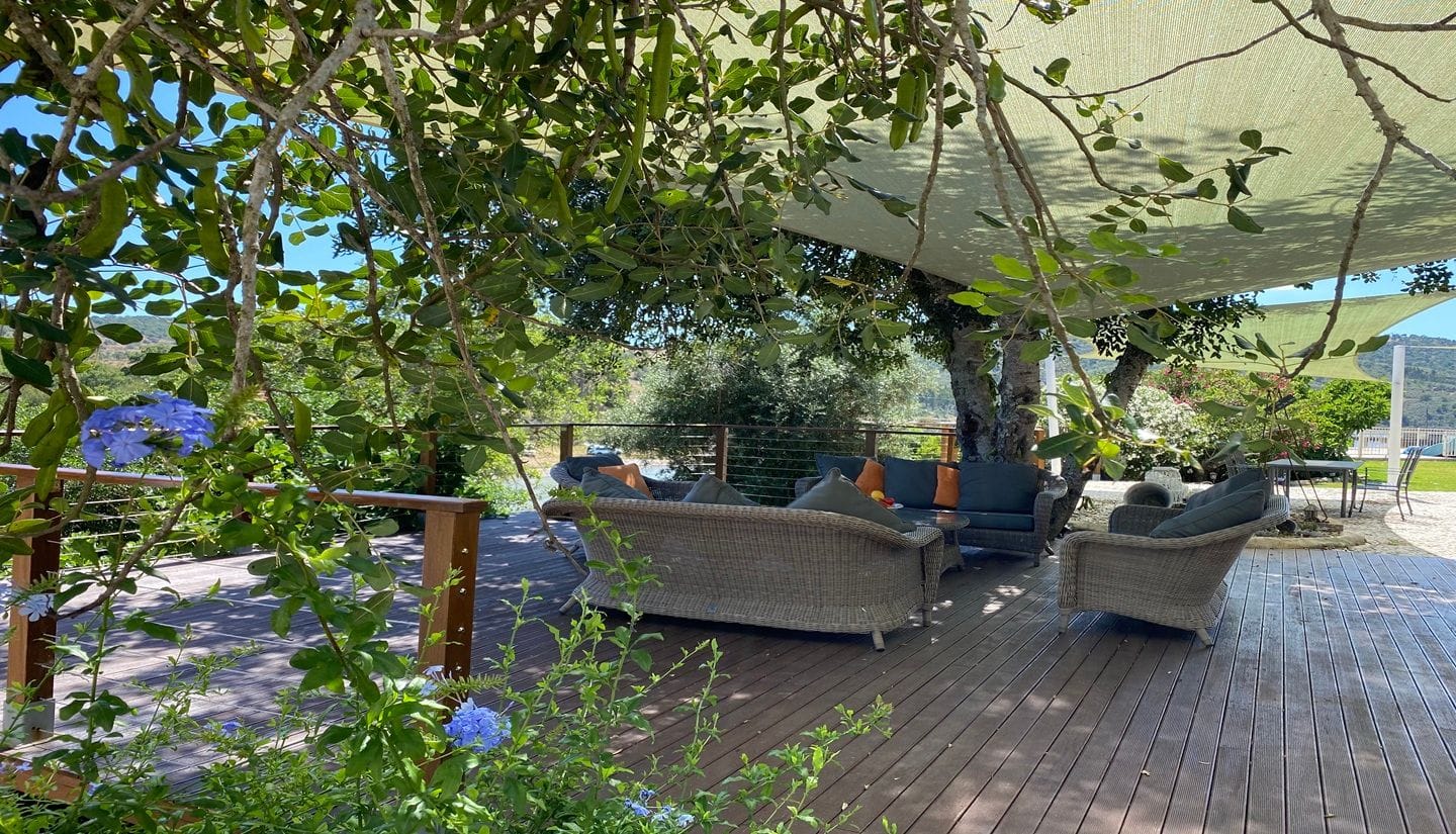 Relaxed outdoor seating area at Figs on the Funcho, where guests unwind between cooking sessions.